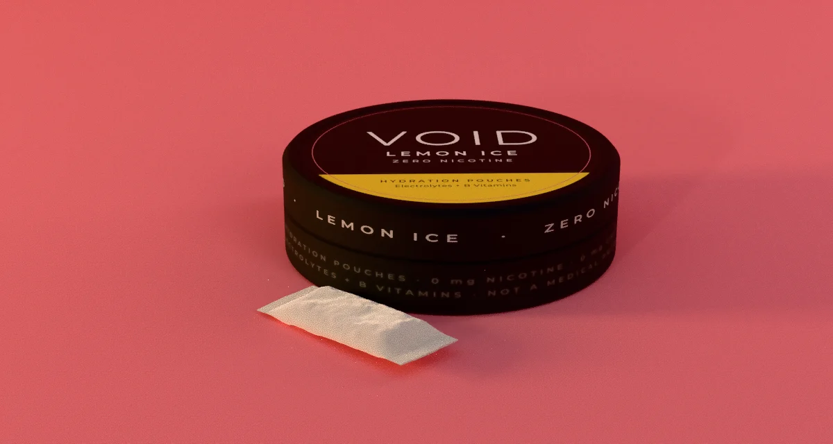 A closed VOID can with one pouch resting beside it in low, warm light.